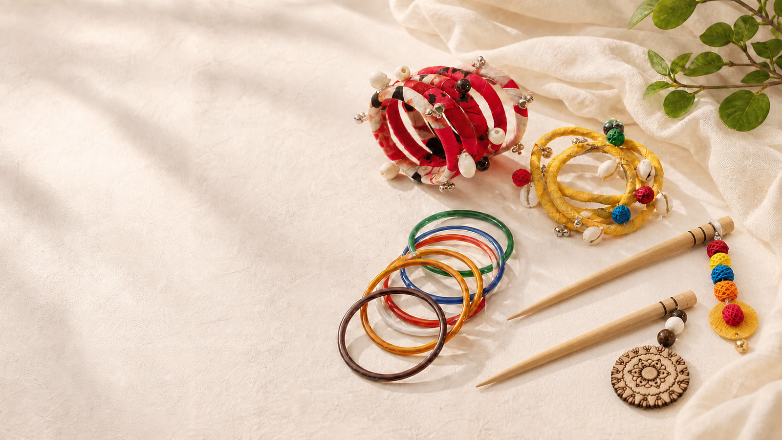 Handmade fabric bangles, shell jewelry and carved wooden hair accessories arranged in warm daylight